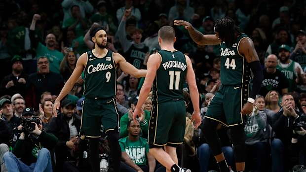Boston Celtics guard Derrick White, guard Payton Pritchard, center Robert Williams